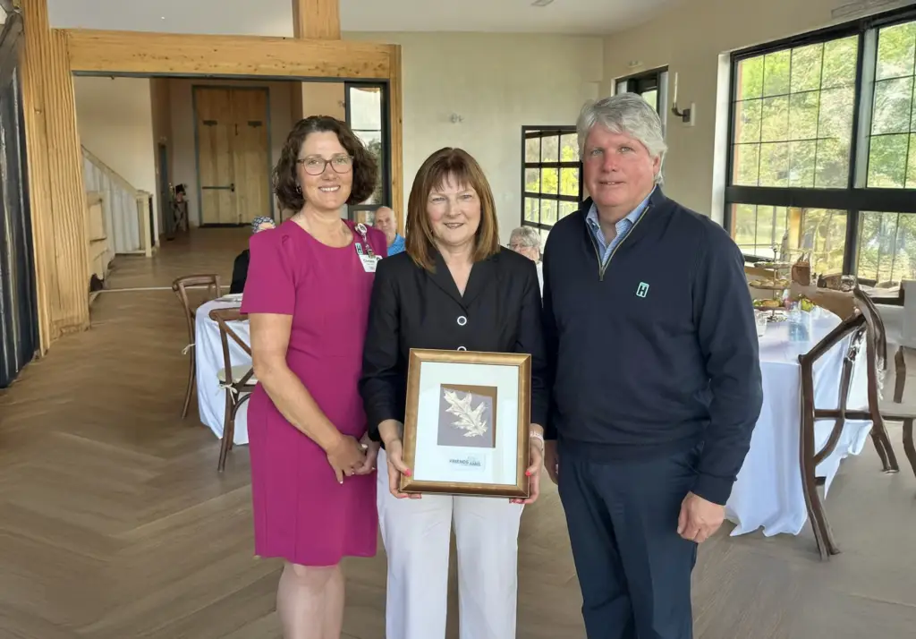 Three Adults hold a Gift in your Will picture frame